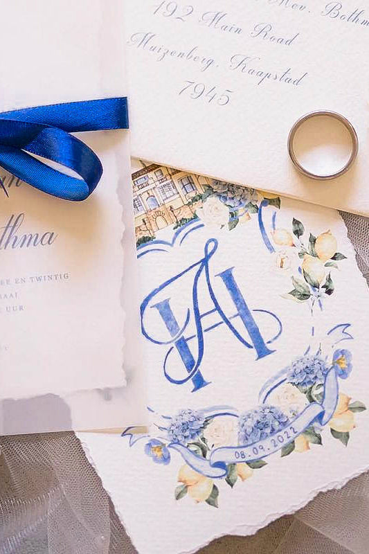 Lumina Studio wedding crest invitation with Elegant Quill monogram